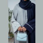 Pastel blue and navy Nidha open-front abaya with handwork on the front – formal modest wear