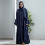 Midnight Bloom Abaya – Navy blue open-front Nidha abaya with cutwork embroidery on sleeves and hemline