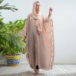 Pastel pink Sahar Blush Abaya in lightweight Nidha with embroidered cutwork cape design.