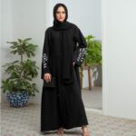 Black Nidha open-front abaya with cutwork and handwork details on sleeves and back – formal modest wear