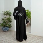 Black Nidha open-front abaya with cutwork and handwork details on sleeves and back – formal modest wear